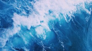 blue sea water with white foam