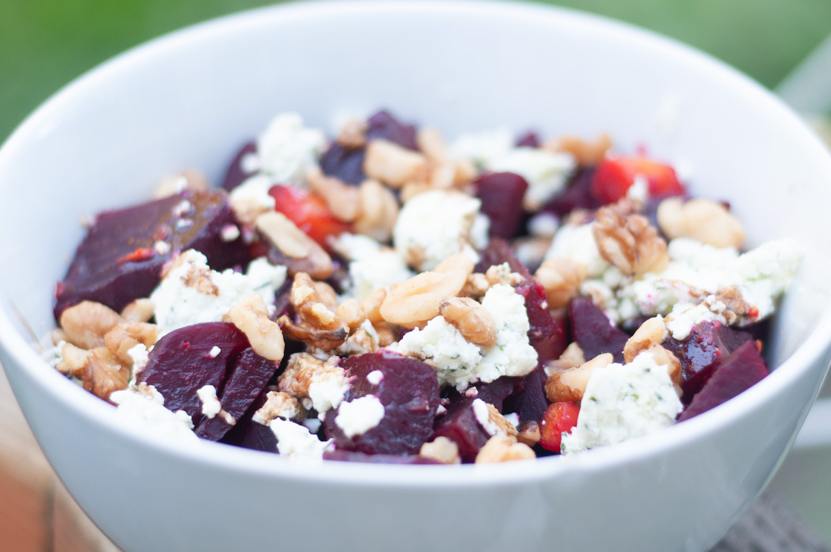 Beet Chevre Walnut salad in a white bowl
